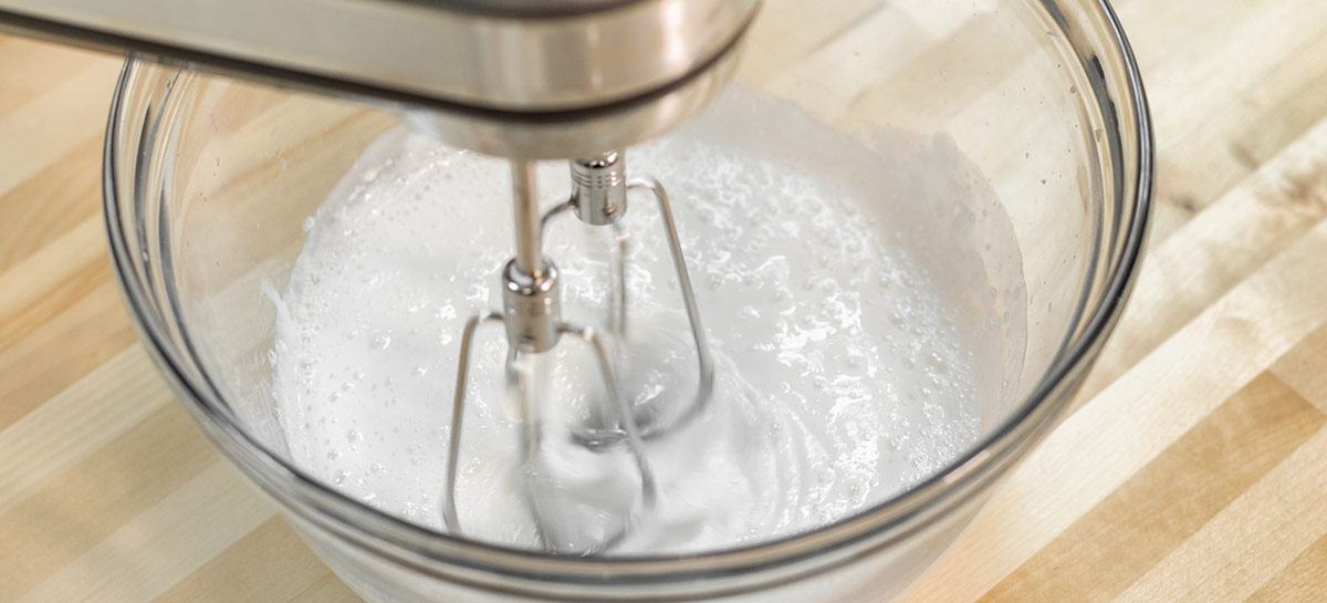 Whipping soap base with a hand mixer.