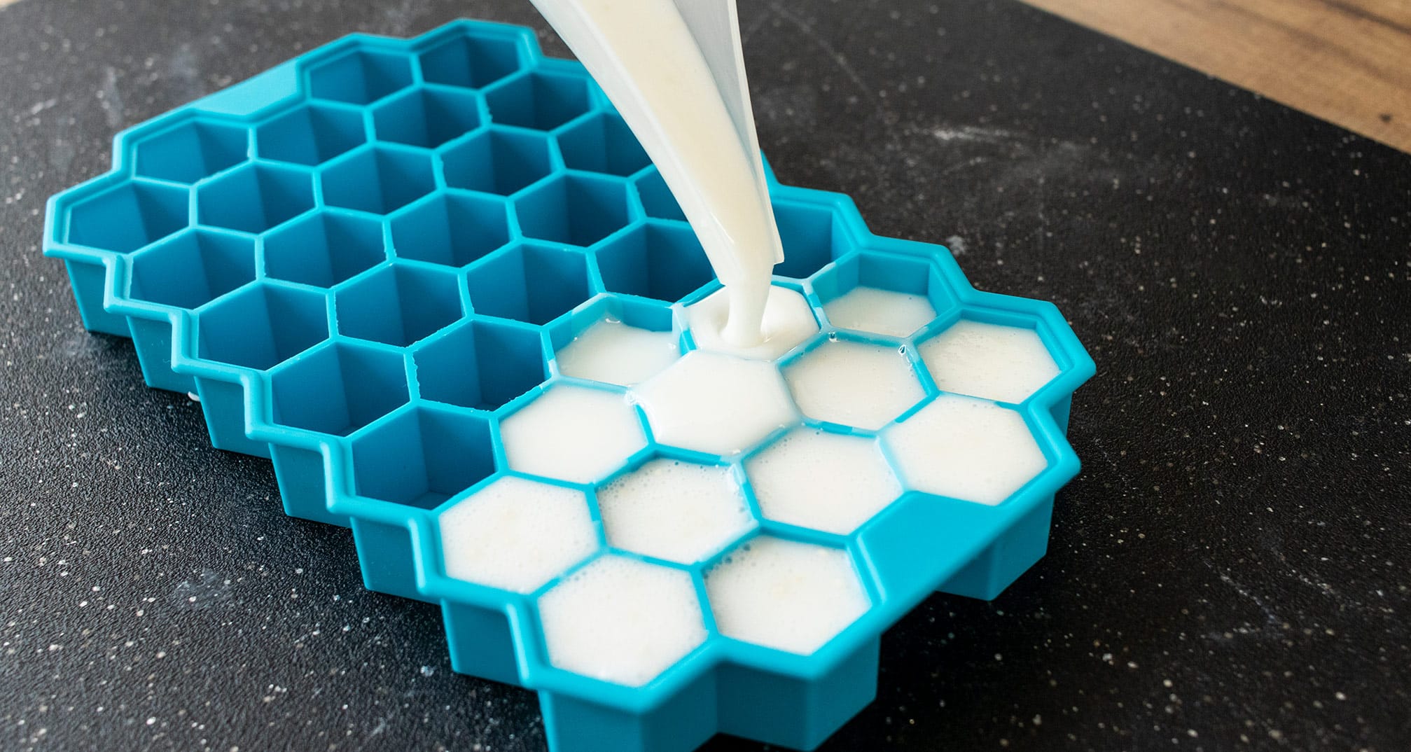Pouring soap into a hexagon silicone soap mold