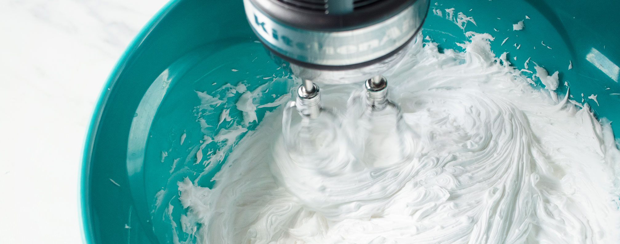 Whipping soap base with a hand mixer.