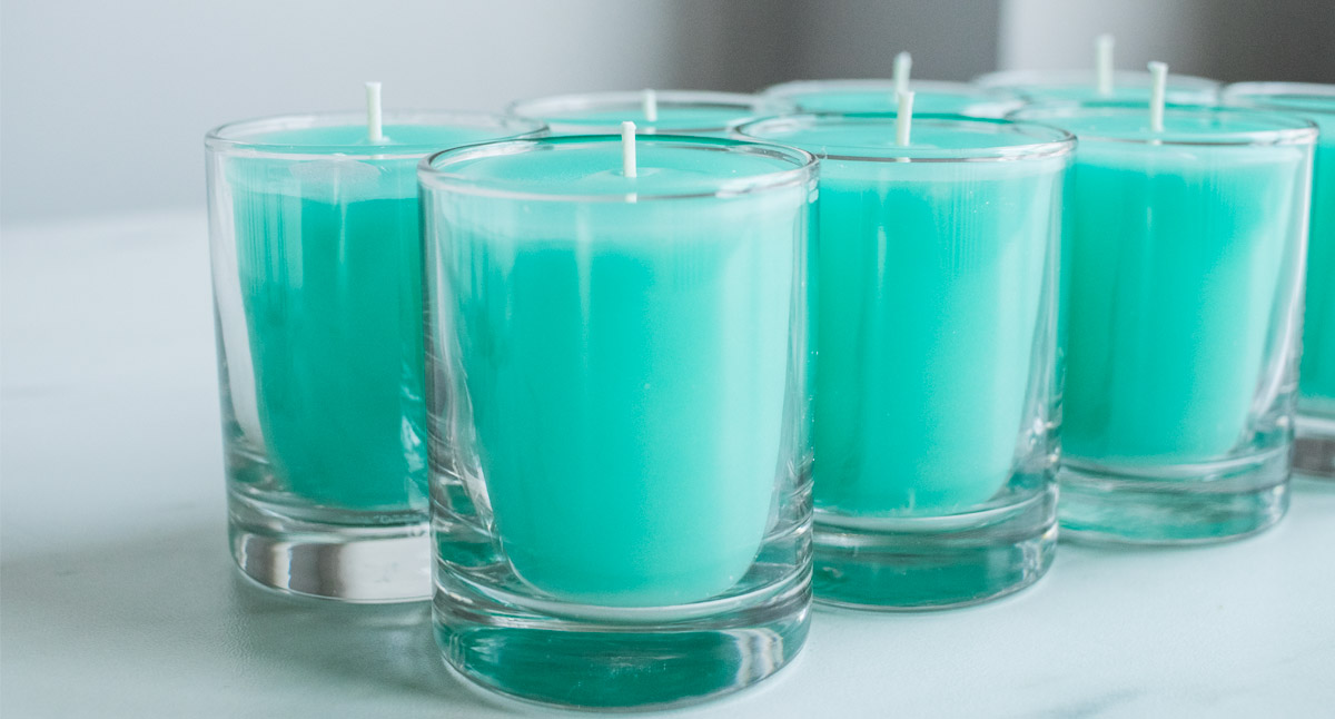 Votive candles dyed with seafoam dye block.