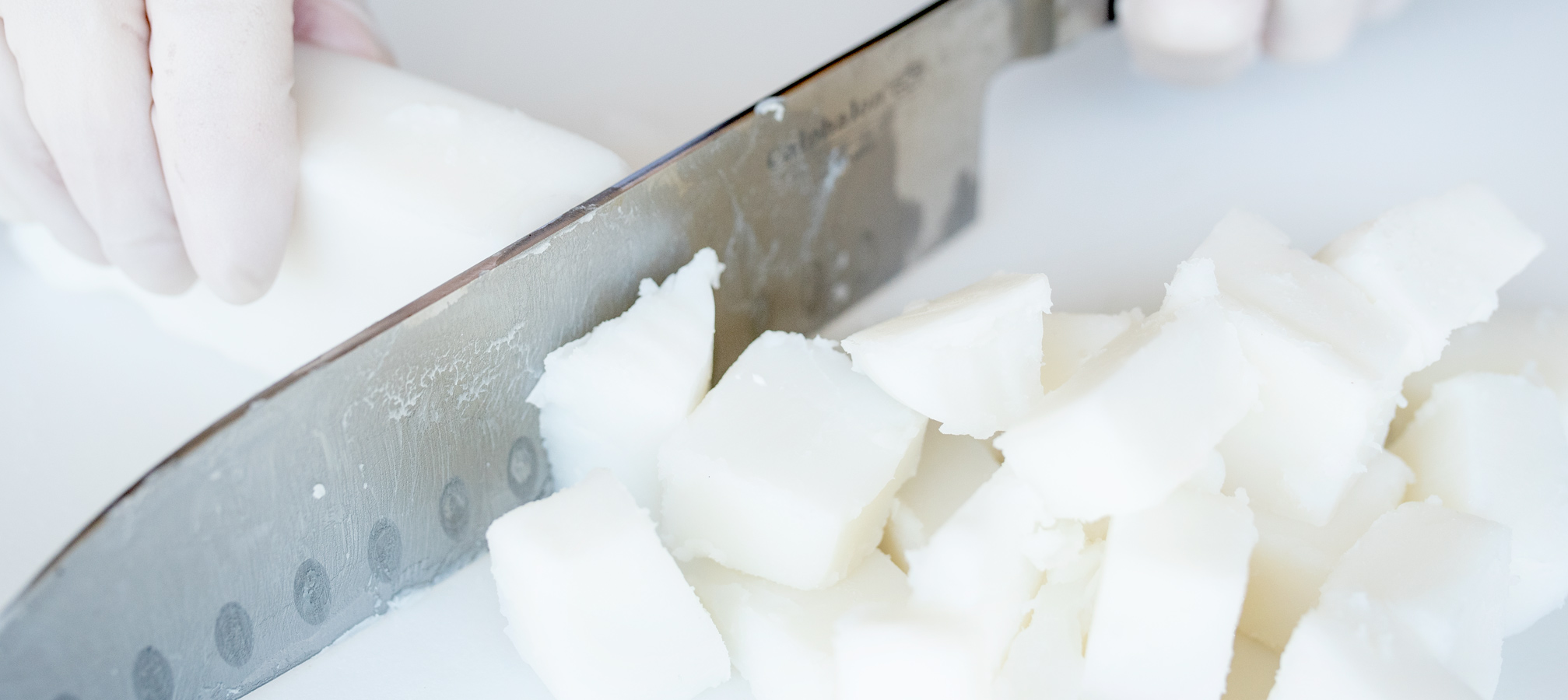 Cutting foaming bath butter base into cubes