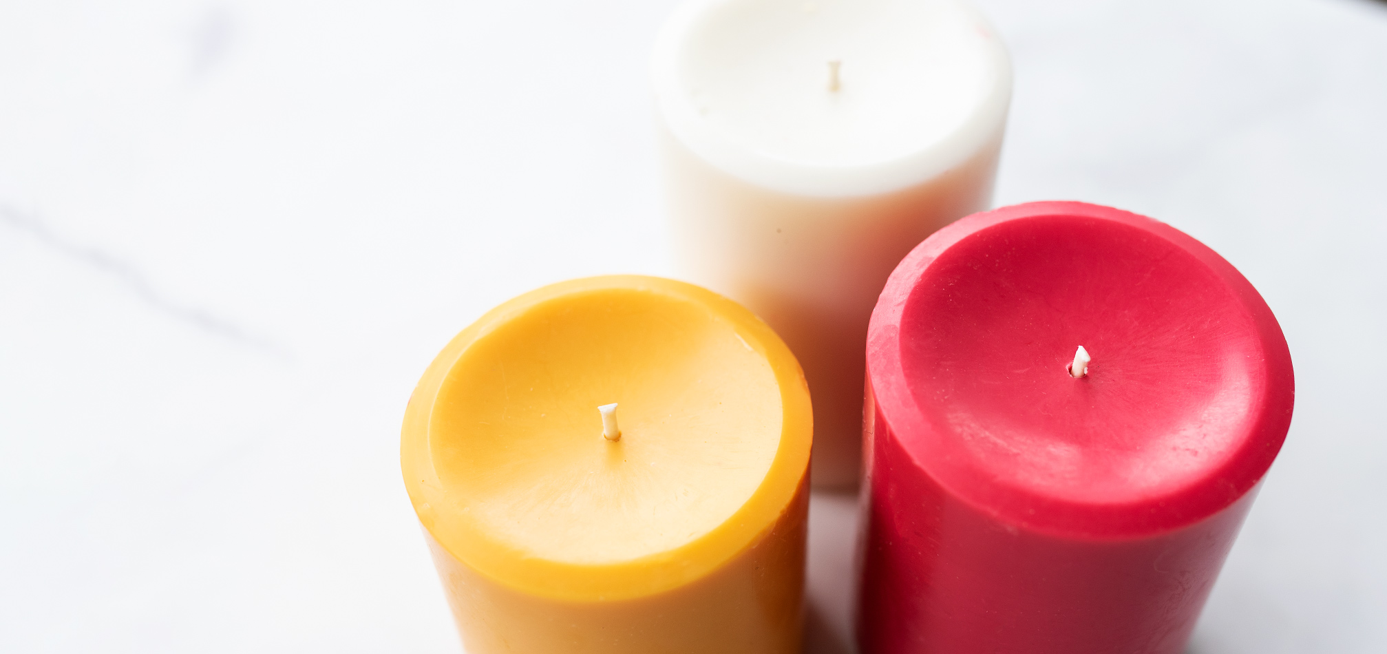 Colored pillar candles made with paraffin and soy wax blend