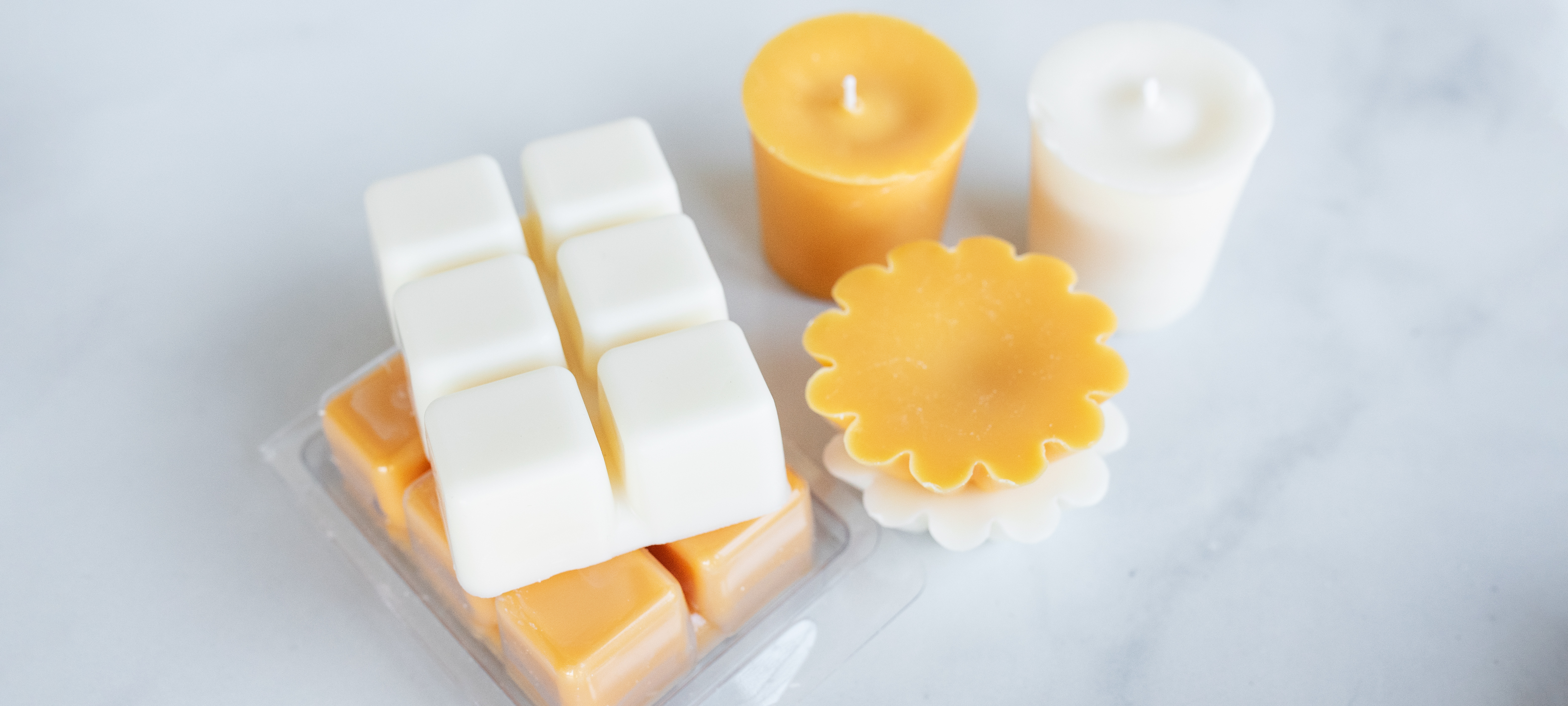 Soy wax melts, clamshells, votives, and wax tarts.