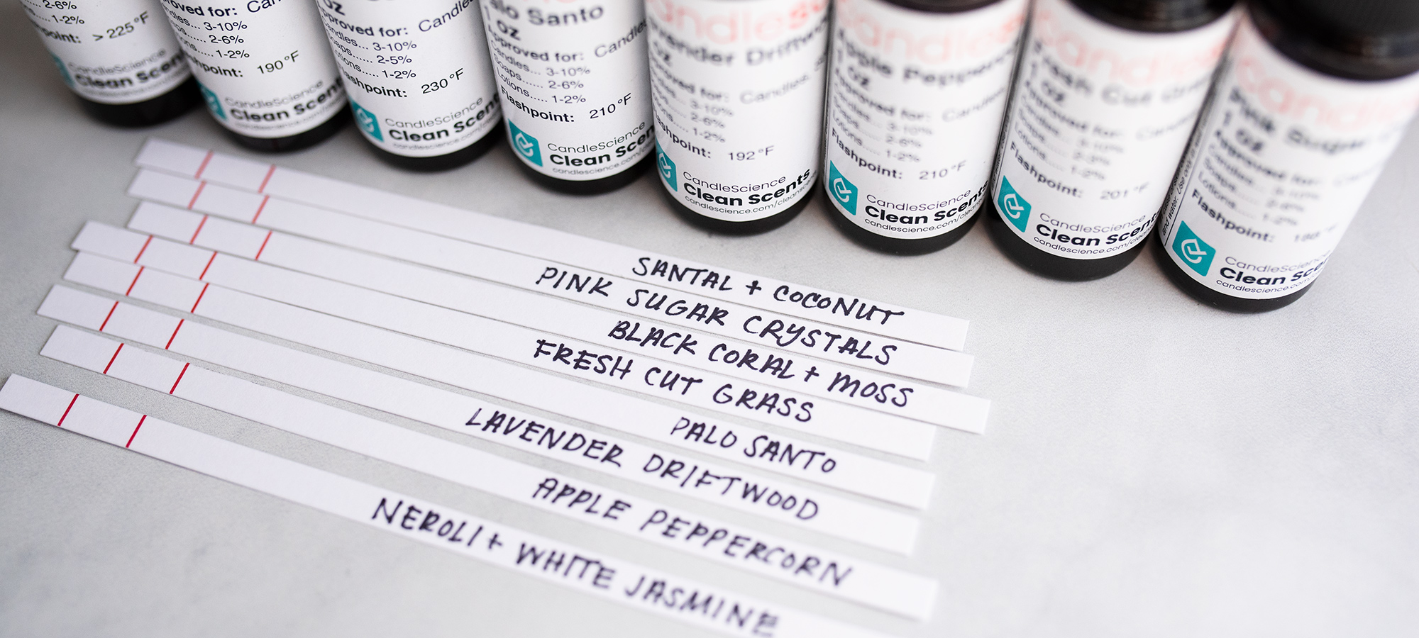 Behind the Scents: 2021 Spring and Summer Fragrance Oils Spring and summer fragrance oil bottles and blotter strips