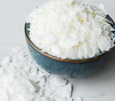 Soy wax flakes in a bowl.