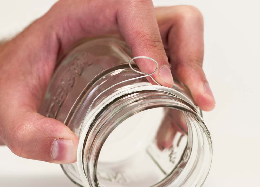 Making a loop in the wire around the neck of the mason jar