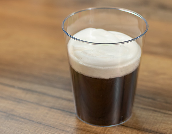 Stout style beer soap cup on table,