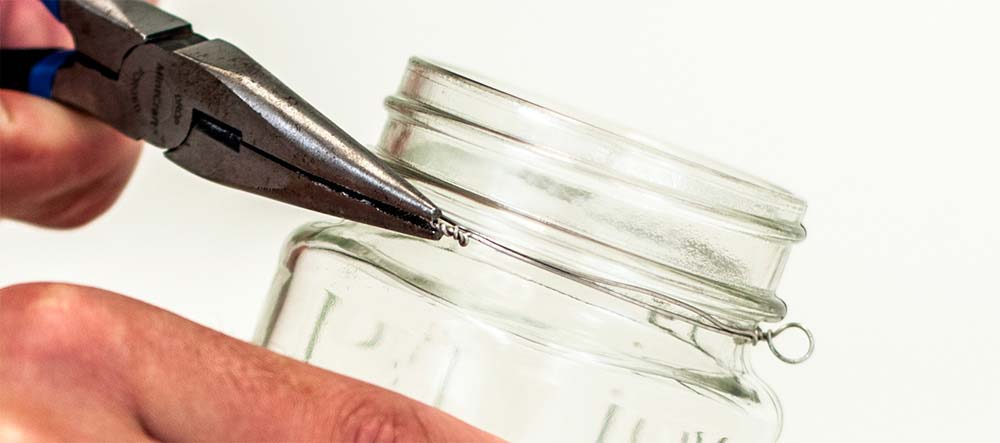 How to make mason jar tealight holders Twist the wire around the jar with pliers.