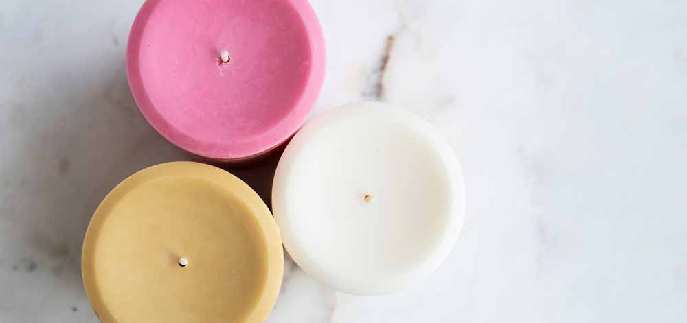 Pillar wax blend dye colors Candles on a white table.