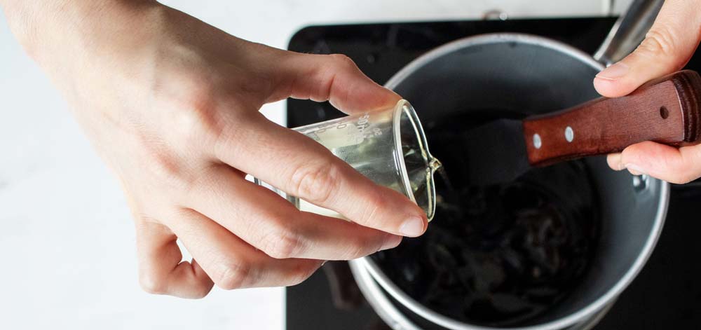 C-3 cargill soy wax lab notes fragrance Pour fragrance into the pitcher.