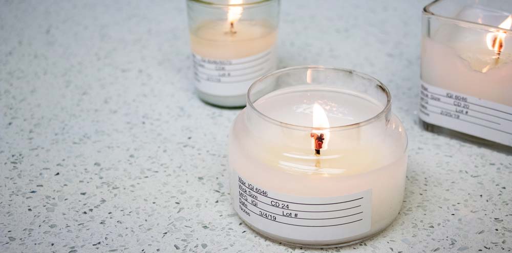 IGI-6046 lab notes burn test candle Final product candles set on a white surface.