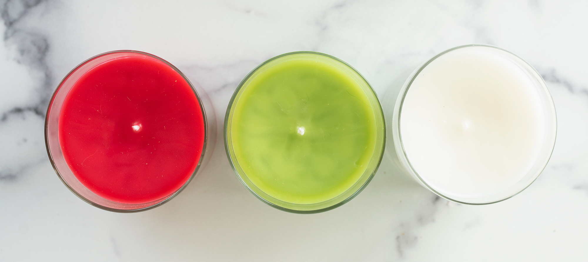 Overhead shot of dyed container candles.