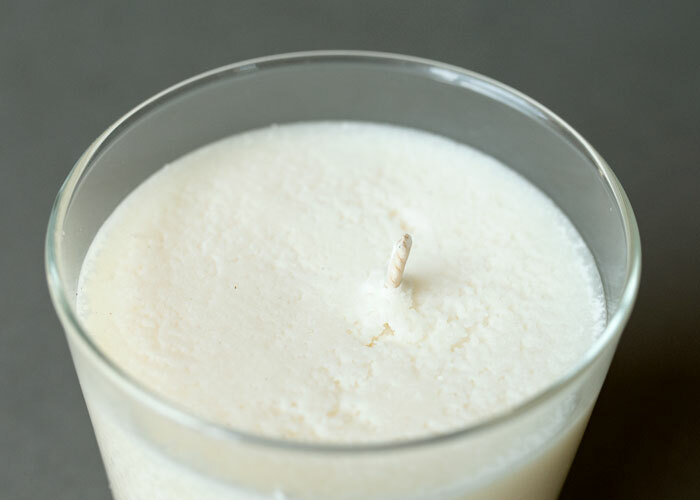 Soy wax candle with rough surface on the top of the candle