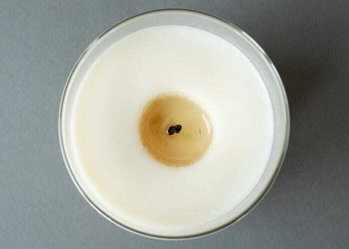 Soy Wax Candle with tunneling hole forming around the wick when burning. 