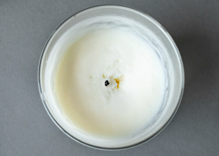 Rough craters on the top of a soy wax candle after burning. 