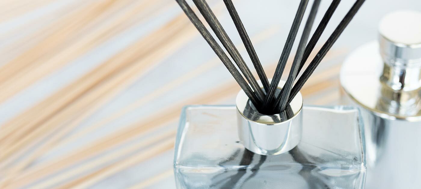 Reed diffuser with black reeds.