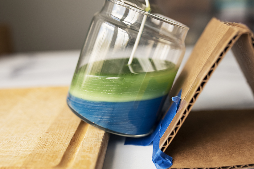 Layered container candle cooling.