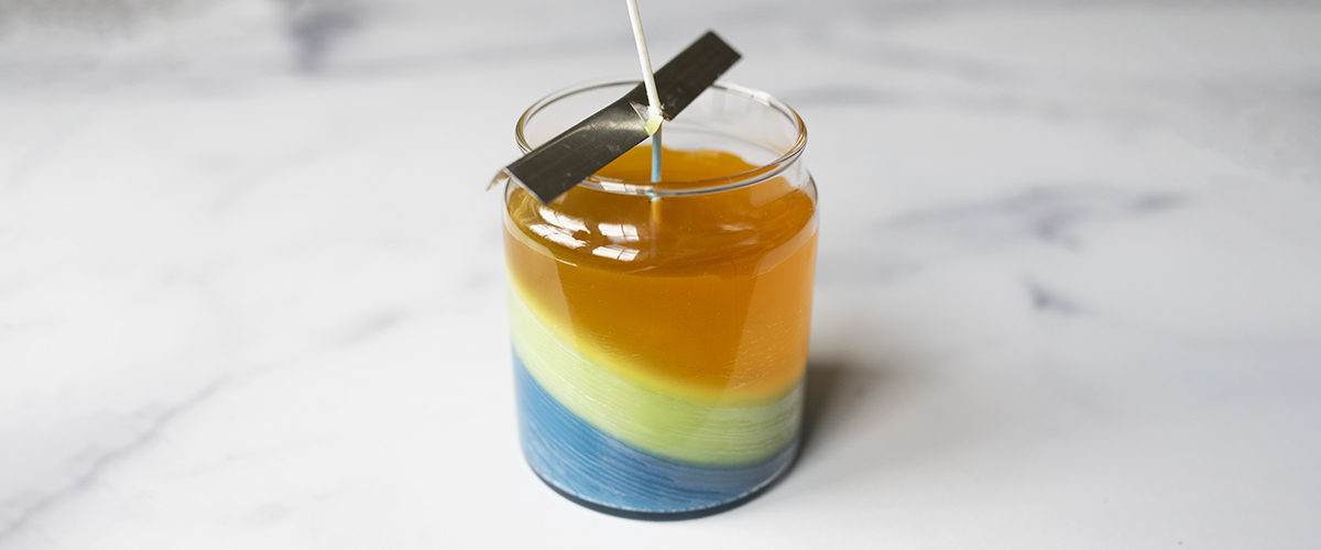 Layered container candle cooling.