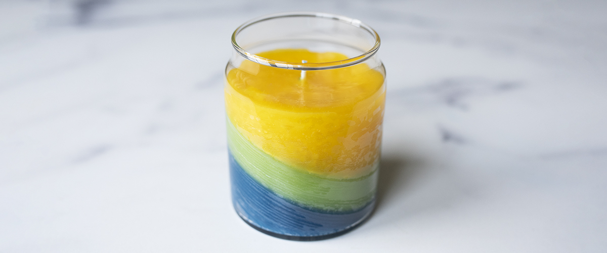 Tilted layer container candle.