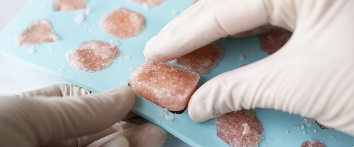 Removing sugar scrubs from silicone mold.