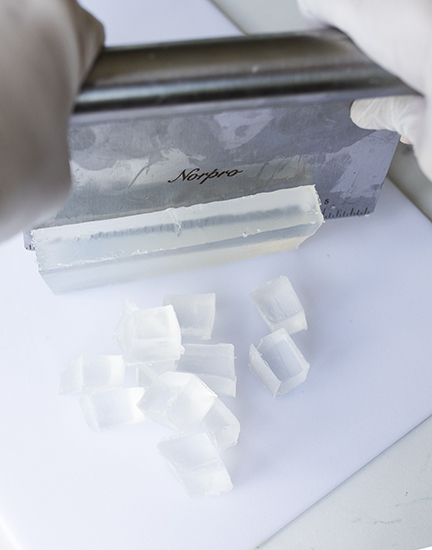 Cutting soap into cubes.