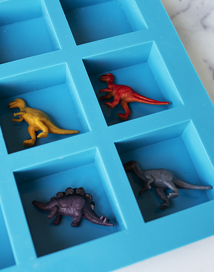 Toy dinosaur in a soap mold.