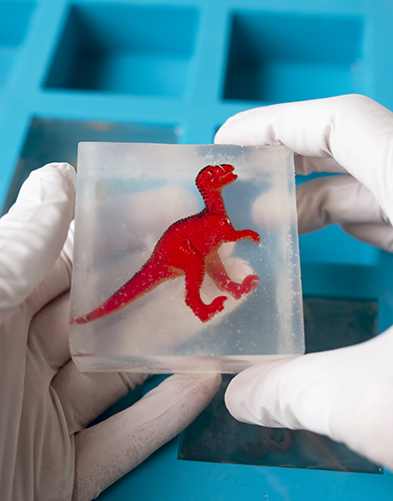 Clear soap with a dinosaur in it.