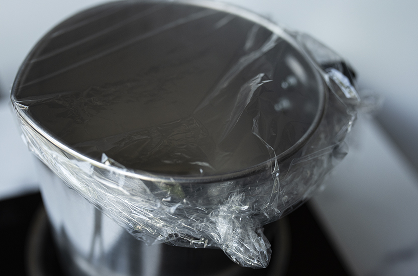Plastic wrap covering pouring pitcher.
