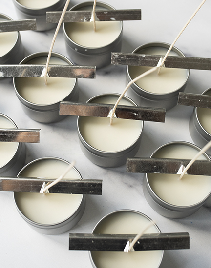 Cooling candle tins.