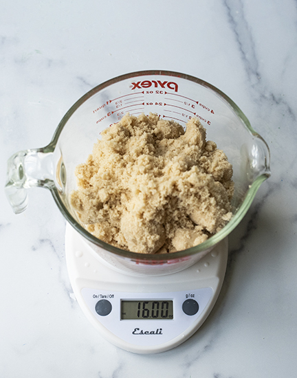 Weighing brown sugar.