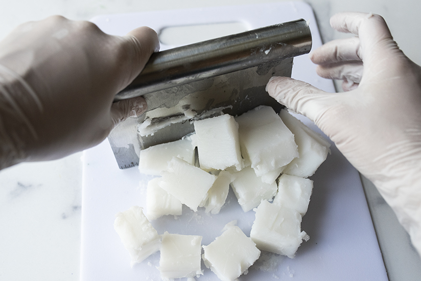 Cutting foaming bath base for scrub into cubes.