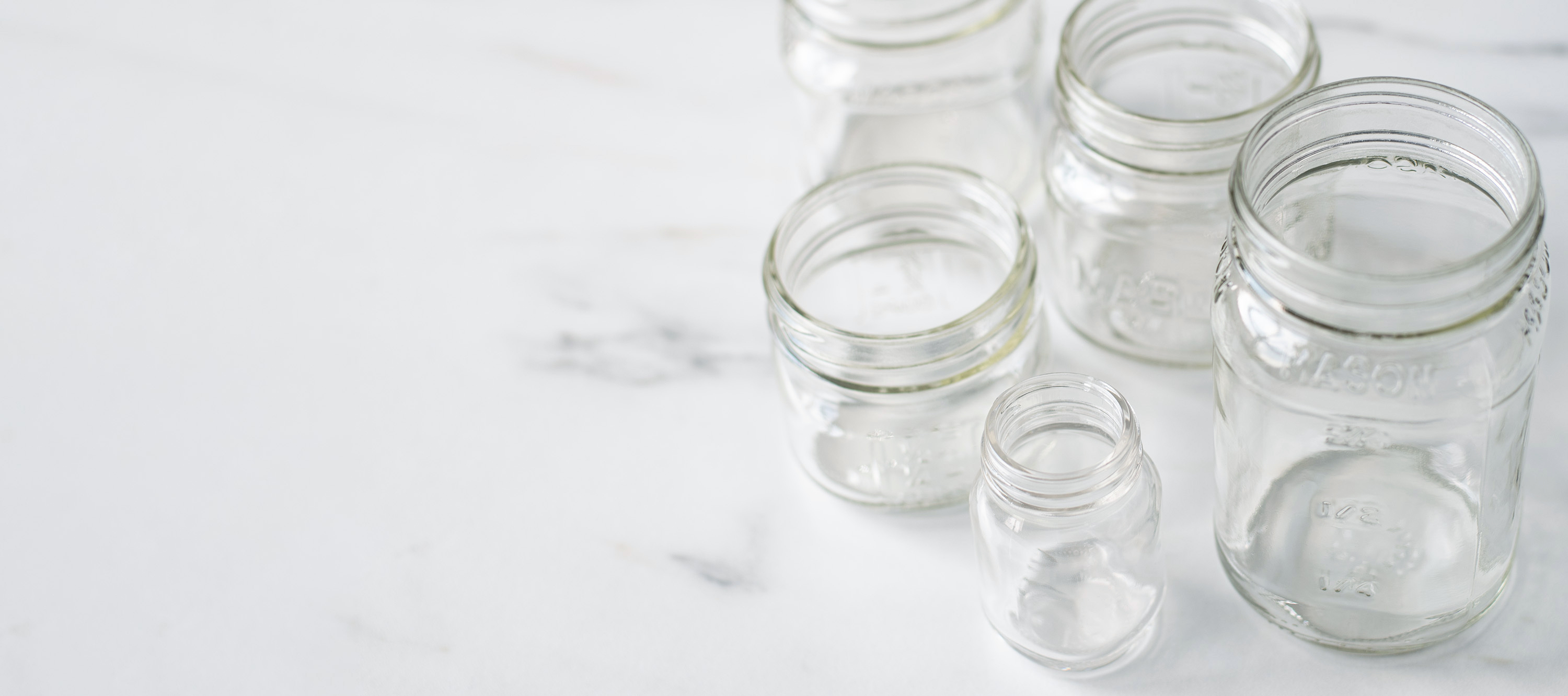 Mason jars in bulk on table