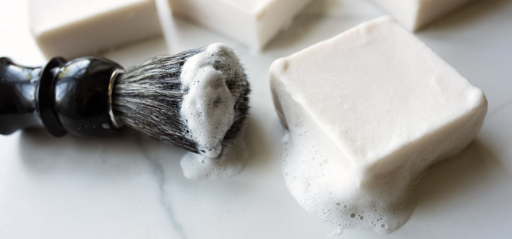 Shave brush lathered with shave bar.