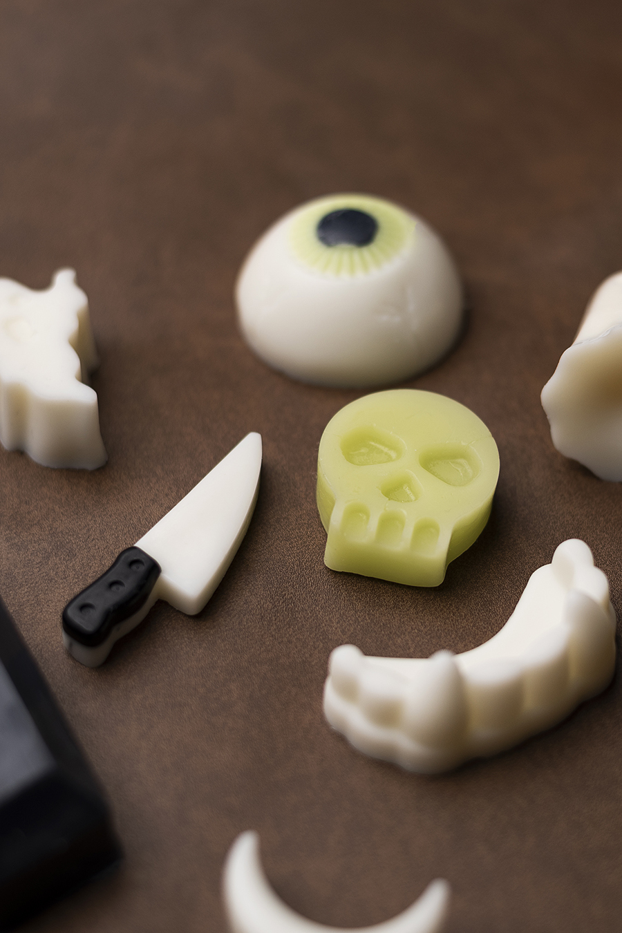 Skull, vampire teeth, and eyeball wax melts.