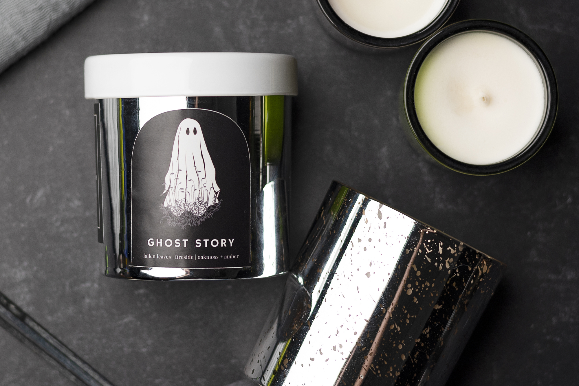 Halloween candle with a silver tumbler jar.