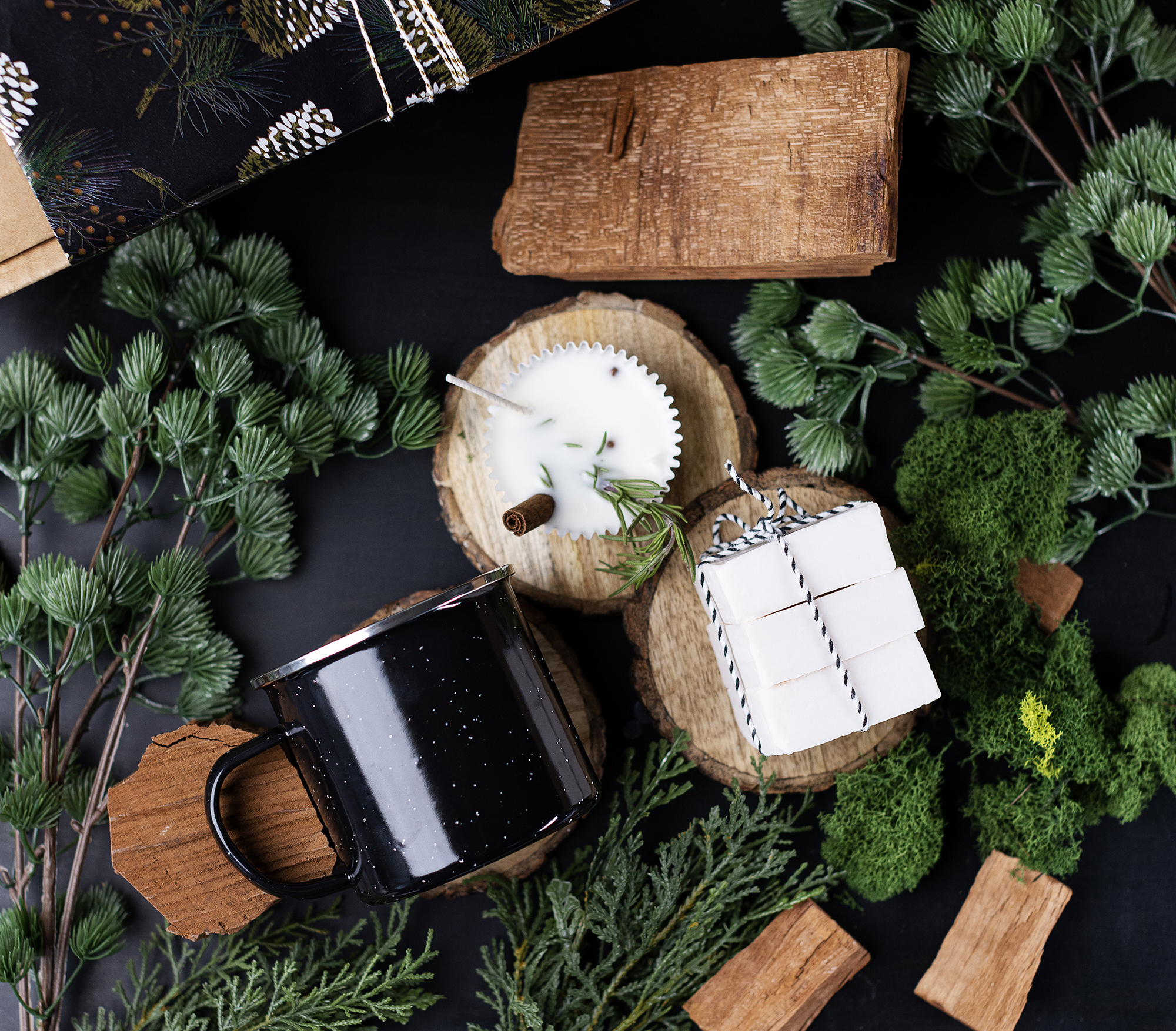 Enamel mug candle, all-in-one shampoo and body bars, and wax fire starters.