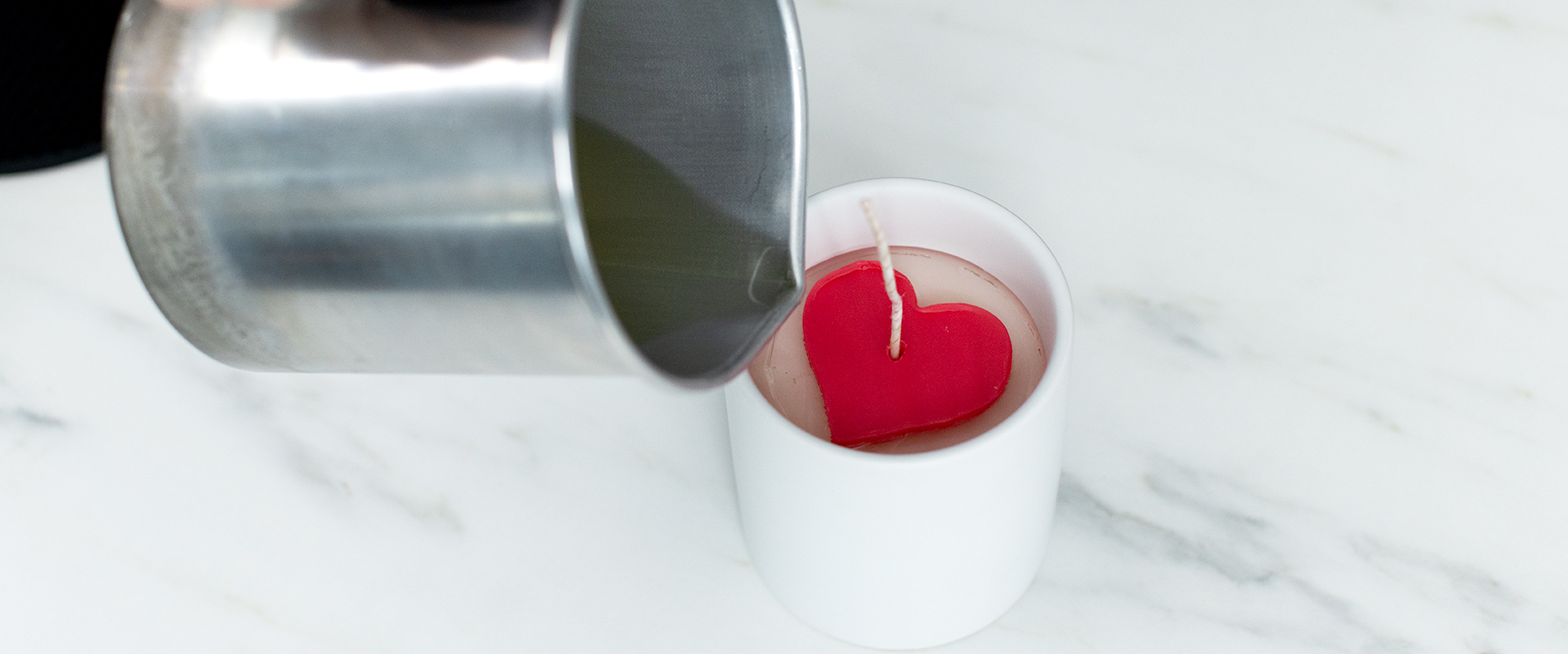 Pouring wax around heart embed.