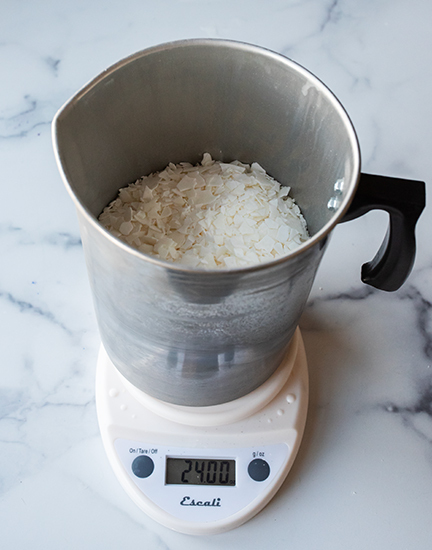 Weighing wax on a digital scale.