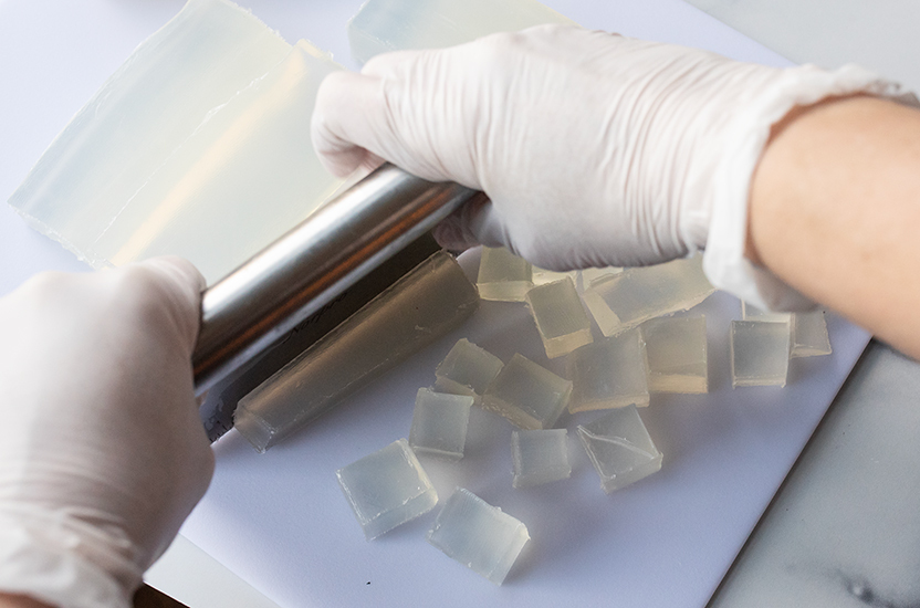 Cutting soap into cubes.