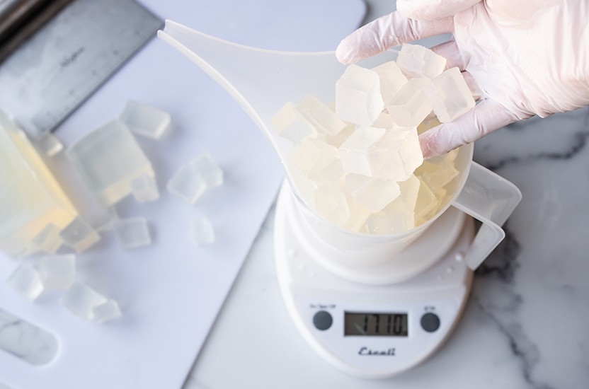 Weighing soap cubes.