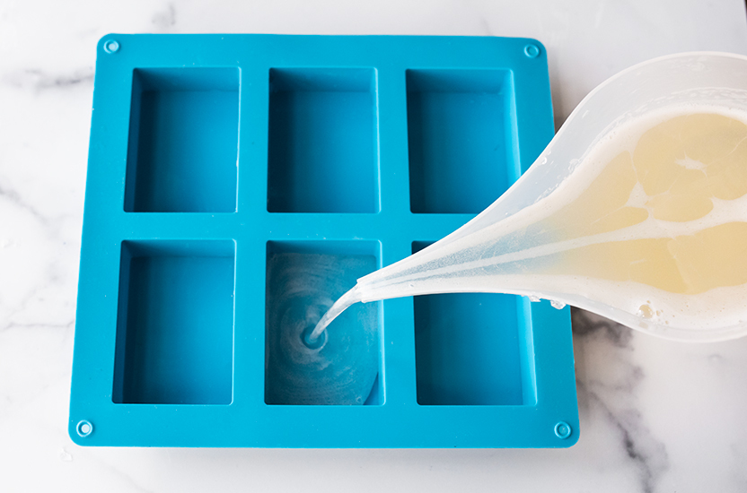 Pouring soap into silicone soap mold.