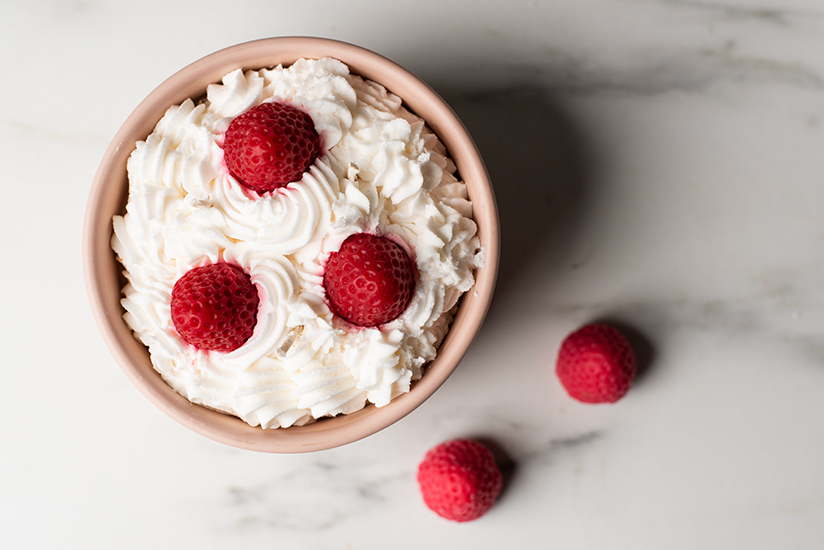 A candle with strawberry embeds.