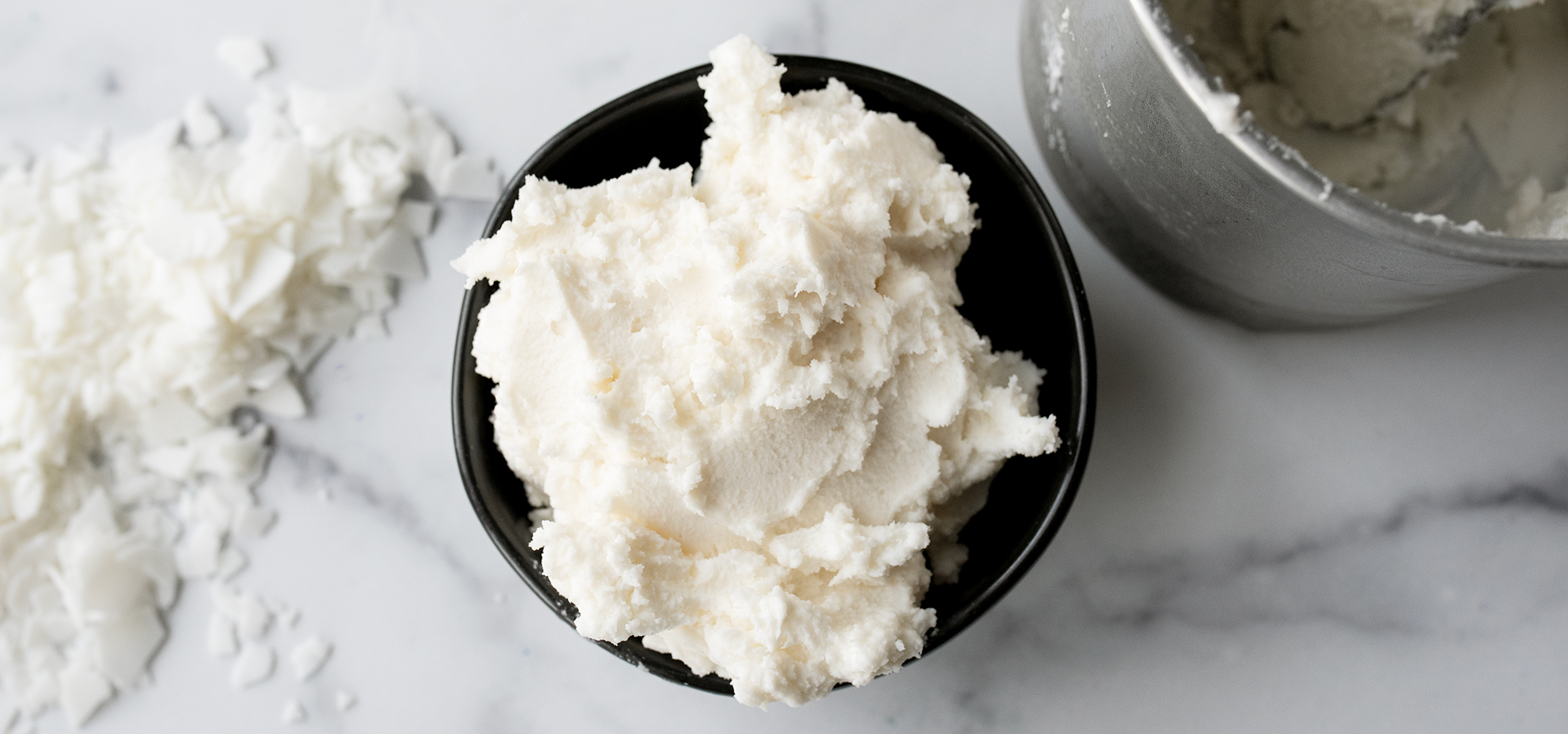 Whipped soy wax in a bowl.