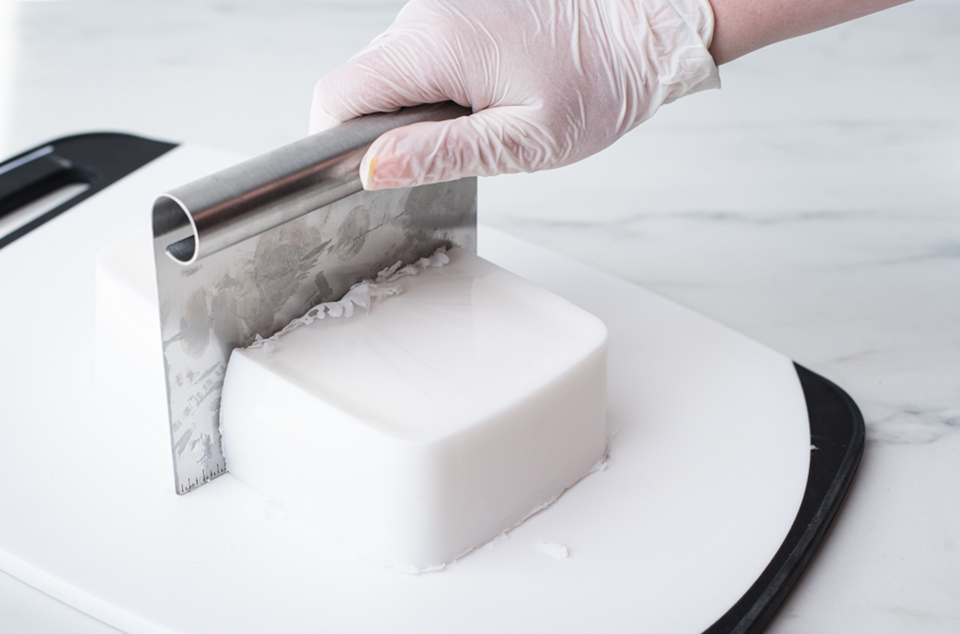 Cutting soap block in half.