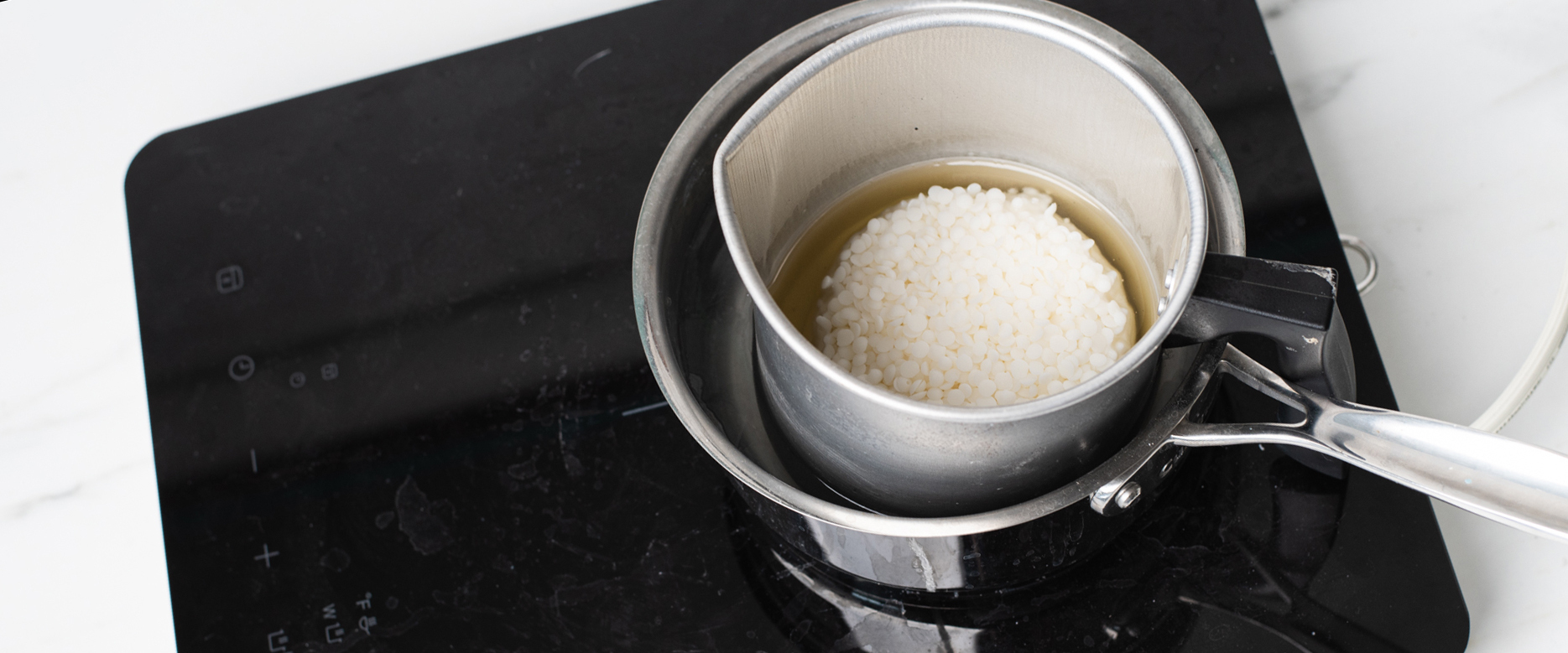 Melting wax on double boiler.