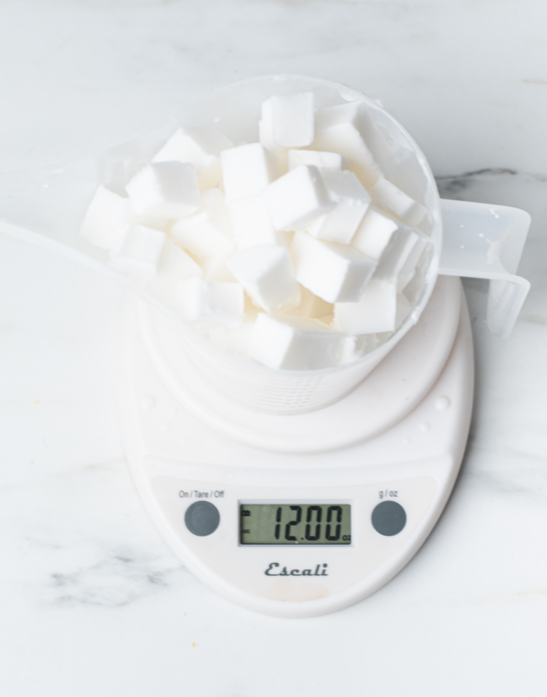 Weighing soap cubes on a digital scale.