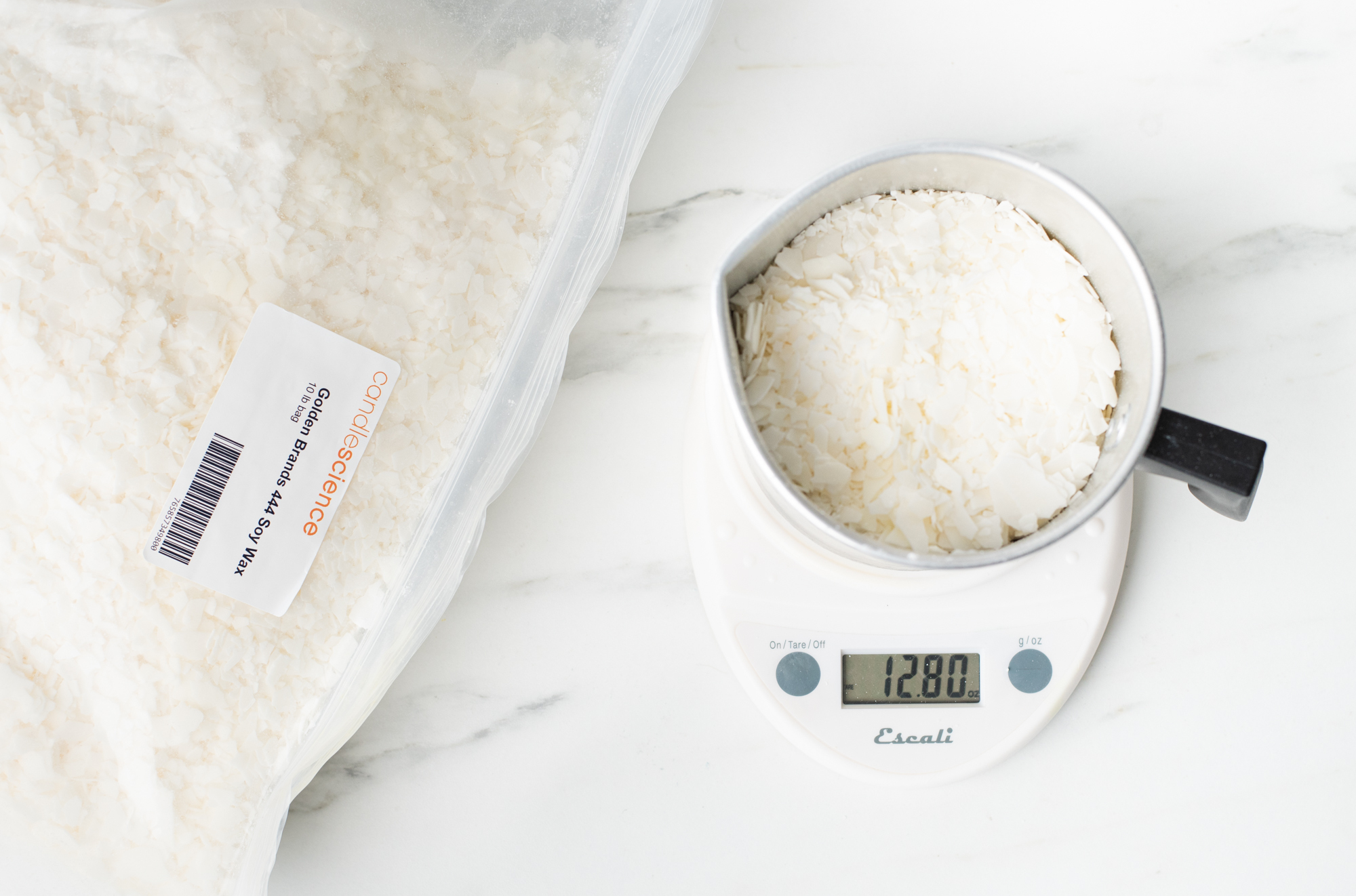 Weighing wax on a digital scale.