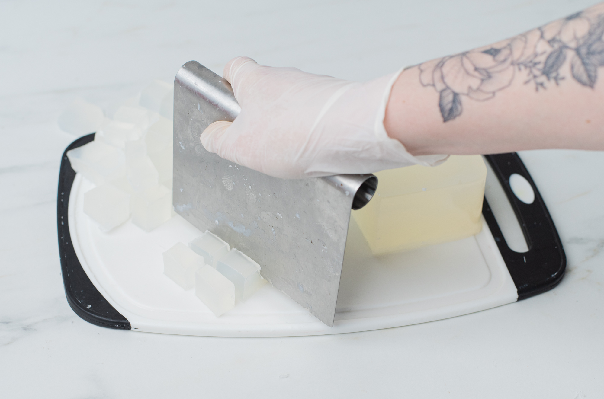 Cutting soap base into cubes.