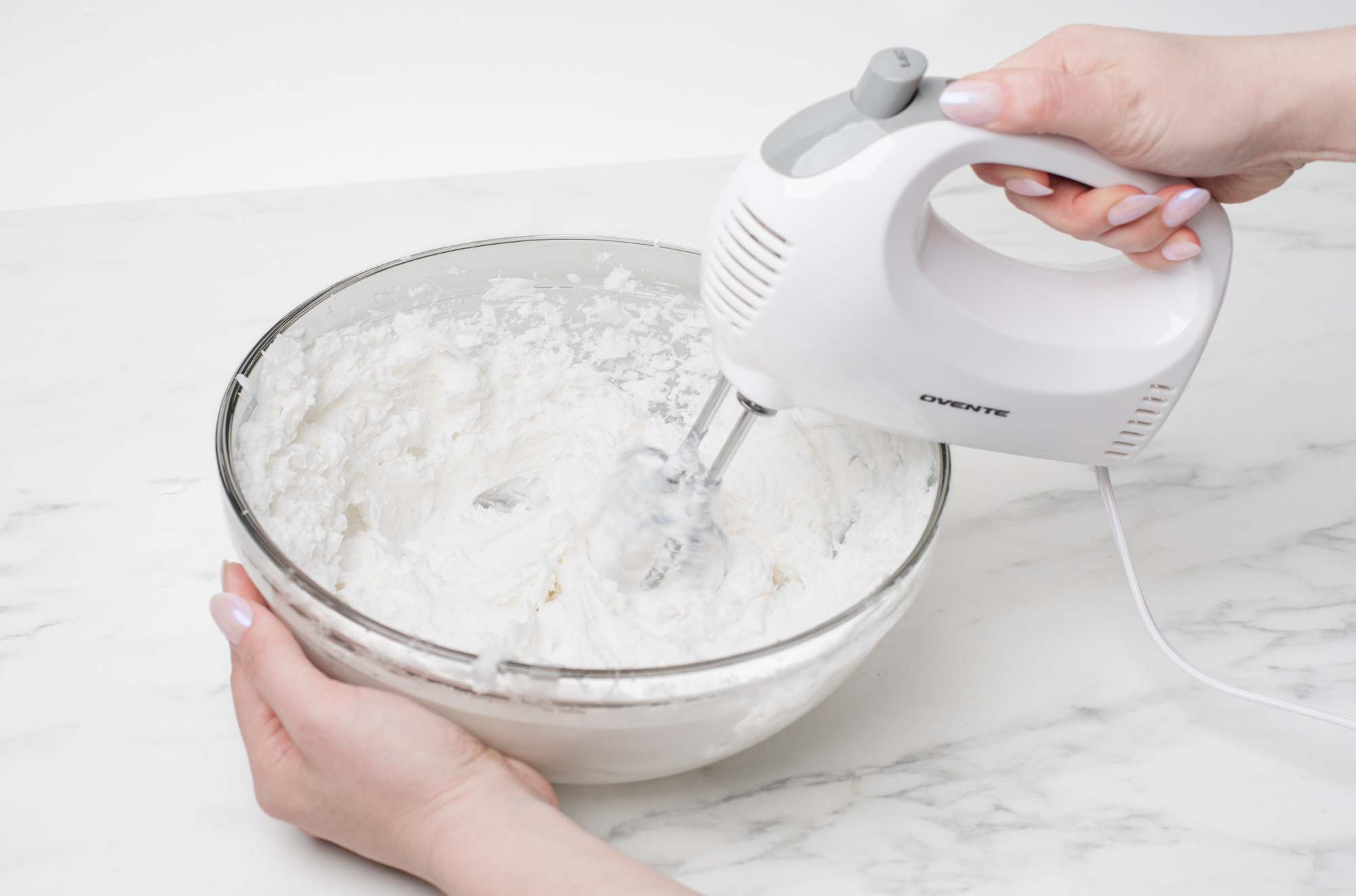 Whipping soap base with a hand mixer.