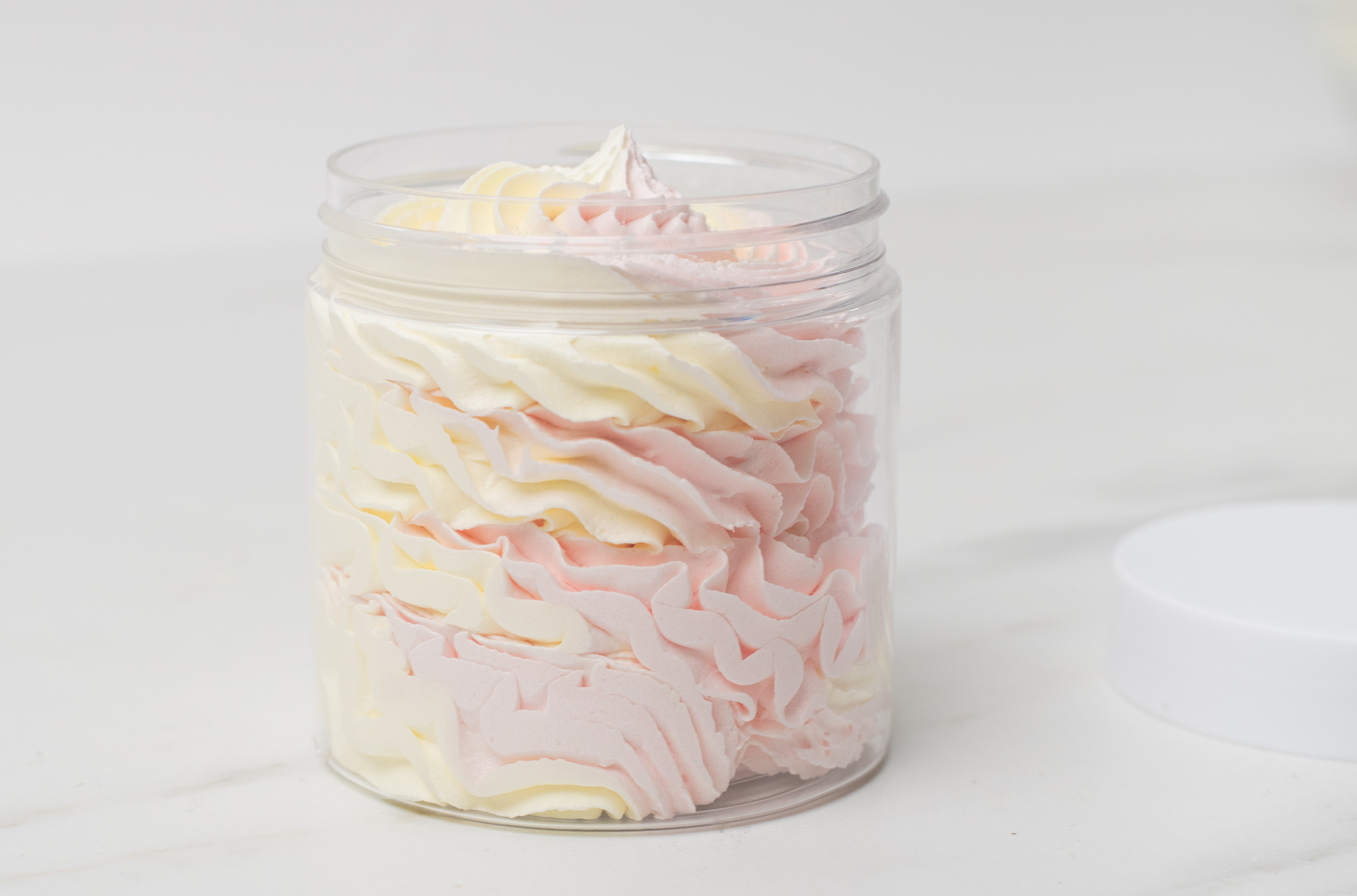 Whipped soap piped in a jar.